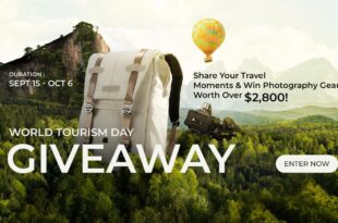 Backpack, camera, hot air balloon, mountain landscape, World Tourism Day giveaway, travel gear, scenic nature, photography contest, enter now, travel promotion.
